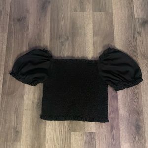 Black puff sleeve crop top.